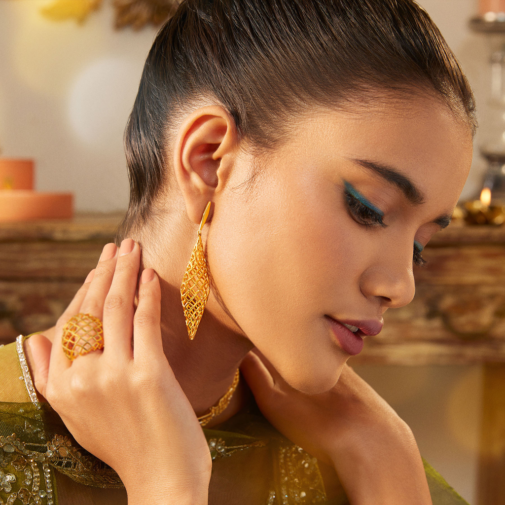 Under The Net Spell Gold Earrings