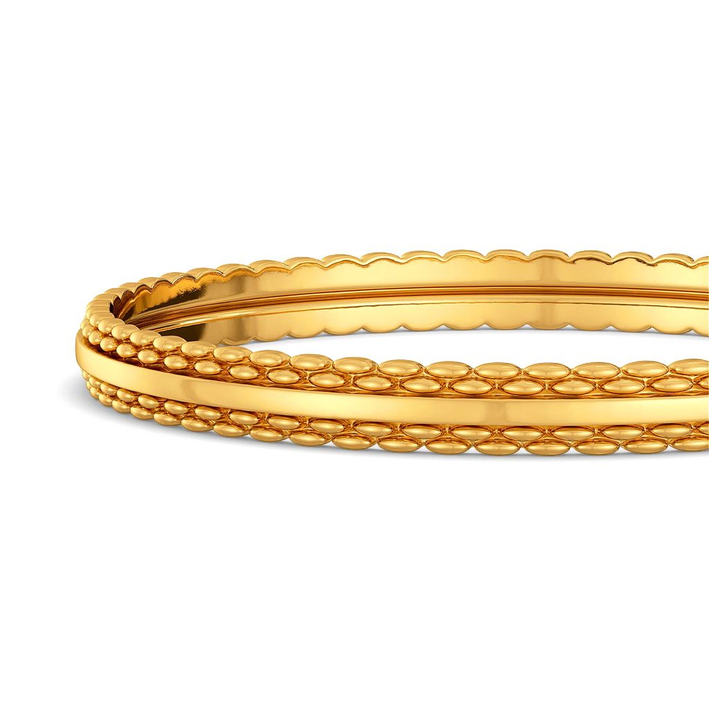 The Tweed Trove Gold Bangles